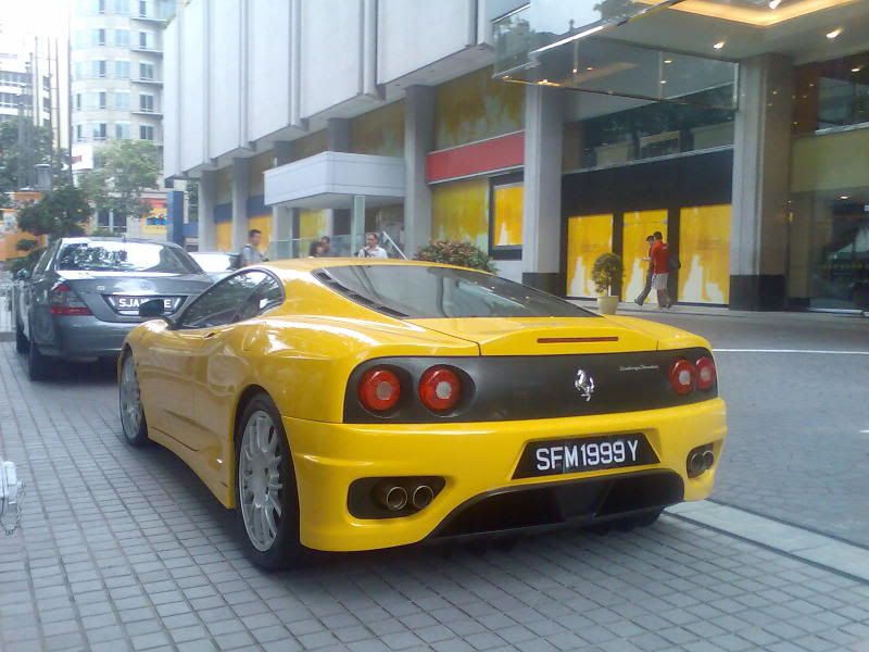 TAKA; back of yellow ferarri